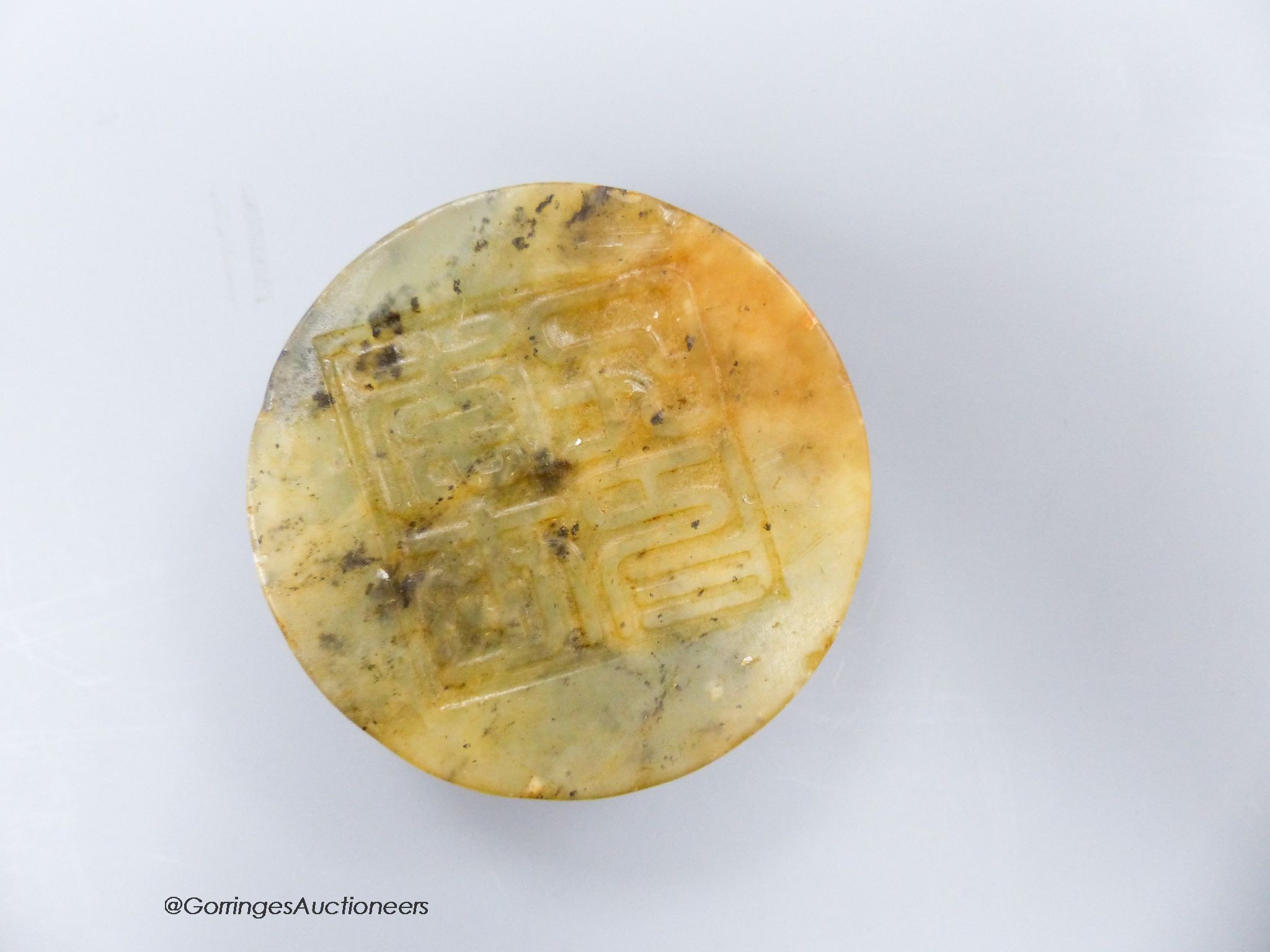 A Chinese soapstone seal disc